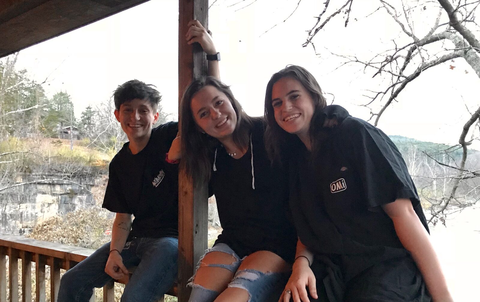 Three siblings on a porch the night before the wedding