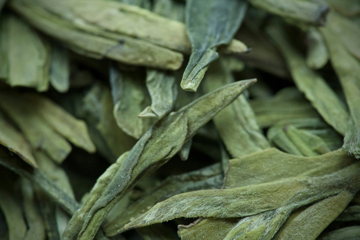 Close-up of dried loose-leaf green tea leaves