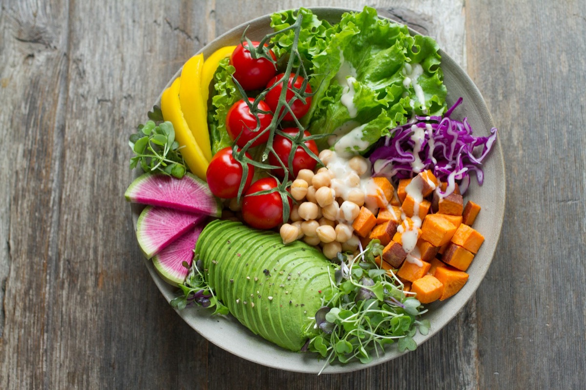 Colorful nutrient-dense bowl with avocado, vegetables, and chickpeas