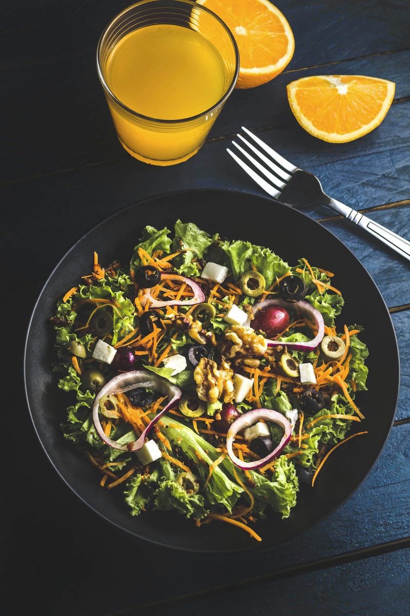 Nutrient-dense salad with greens, carrots, and walnuts