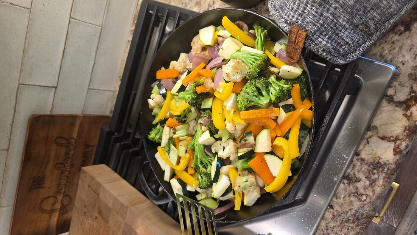 Colorful vegetable stir-fry in a cast iron skillet